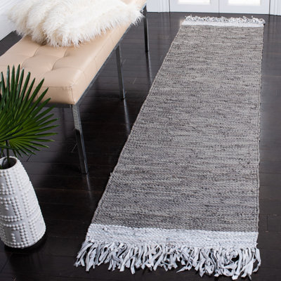 Tapis de couleur unie en coton tissé à la main gris clair Exley