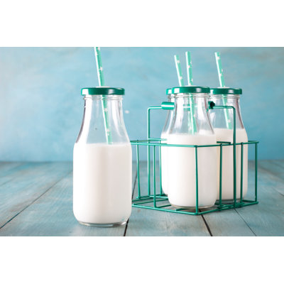 A Bottles Of Milk by Id-art - Wrapped Canvas Print