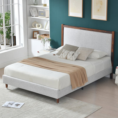 Wooden platform bed with upholstered base