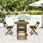 Ensemble repas en bois avec chaises pliantes et coussins