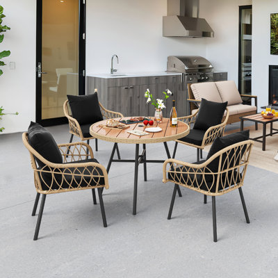 Altrud 4 - Person Patio Dining Set with Round Table , Cushions Included