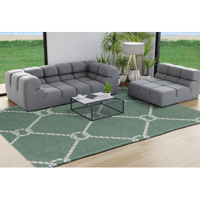 Tapis géométrique sauge à tissage plat