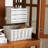 Antique Curio Display Cabinet With Glass Doors, Adjustable Shelves, Integrated Lighting, And Four-Door Vintage Design For Collectibles Showcase.