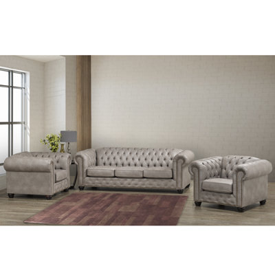 Canapé Chesterfield gris clair en similicuir et deux chaises Anim