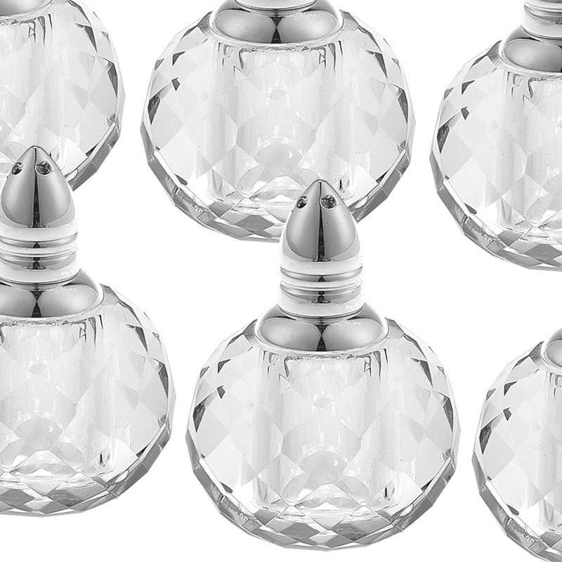 Ensemble de six salières et poivrières en cristal taillé rond et transparent