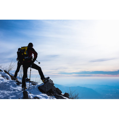 Hikers on Mountain Peak by Deimagine