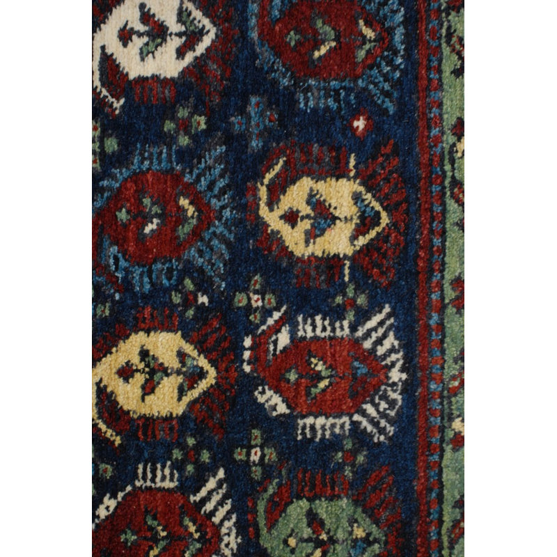 Seychour Wool Oriental Area Rug in Green/Red