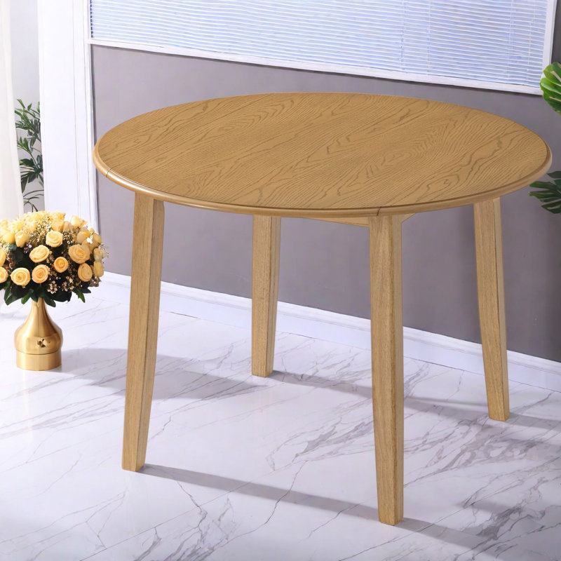 Table de salle à manger ronde extensible (table seule, sans chaises, plateau et pieds inclus) en MDF et bois d'hévéa. Style moderne et gain d'espace pour les petites cuisines.