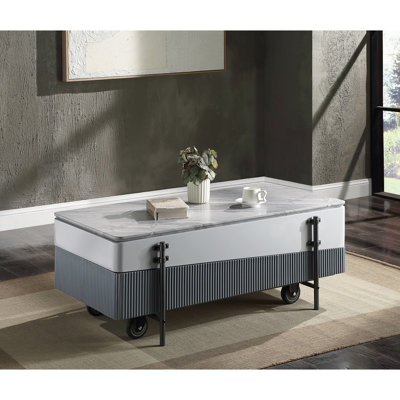 Table basse moderne grise et blanche avec surface relevable et boîte de rangement dissimulée