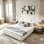 Grand lit de luxe moderne à profil bas avec structure en chenille douce et tête de lit incurvée avec pieds en métal doré poli