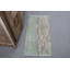 Élégant tapis de porte turc rétro avec des tons de vert doux et un motif floral tissé à la main