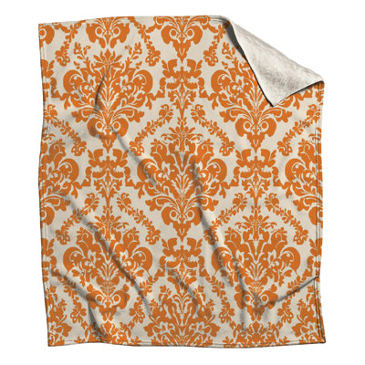 Couvertures orange à motif damassé