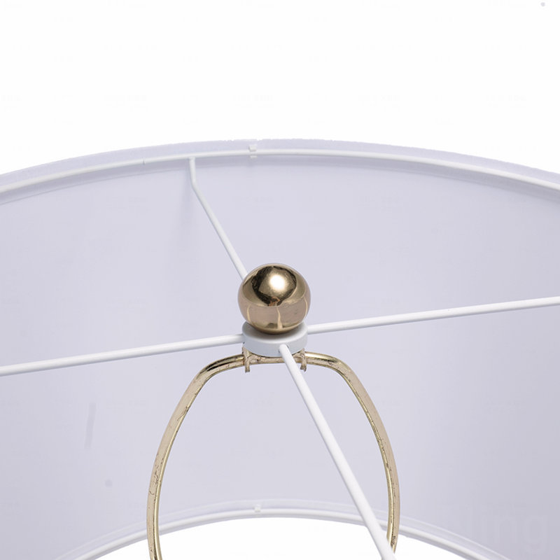 Lampe de table, en or et blanc, avec un corps rond à quatre niveaux
