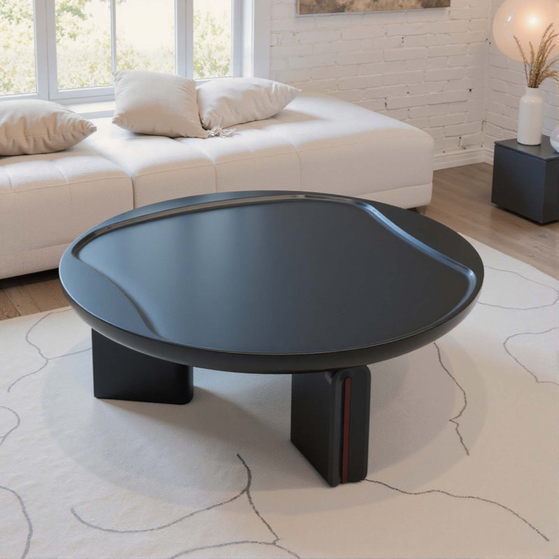 Table basse ronde moderne, en MDF brillant avec plateau concave et piètement à 3 pieds