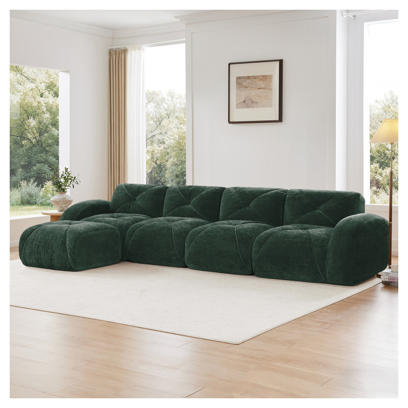 Canapé modulaire en L capitonné vert avec repose-pieds mobile, canapé-lit Cloud Comfort