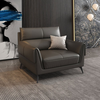 Fauteuil noir avec coussin en cuir véritable