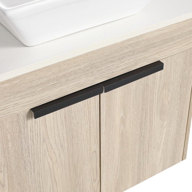 Meuble-lavabo moderne en chêne blanc avec lavabo d'art en céramique. Fixation murale 24 po. Porte à fermeture en douceur. Choix de rangement généreux pour la salle de bain. Poignée en métal. Fixation en ardoise 24 po. Cabinet. Grand bassin de rangement.