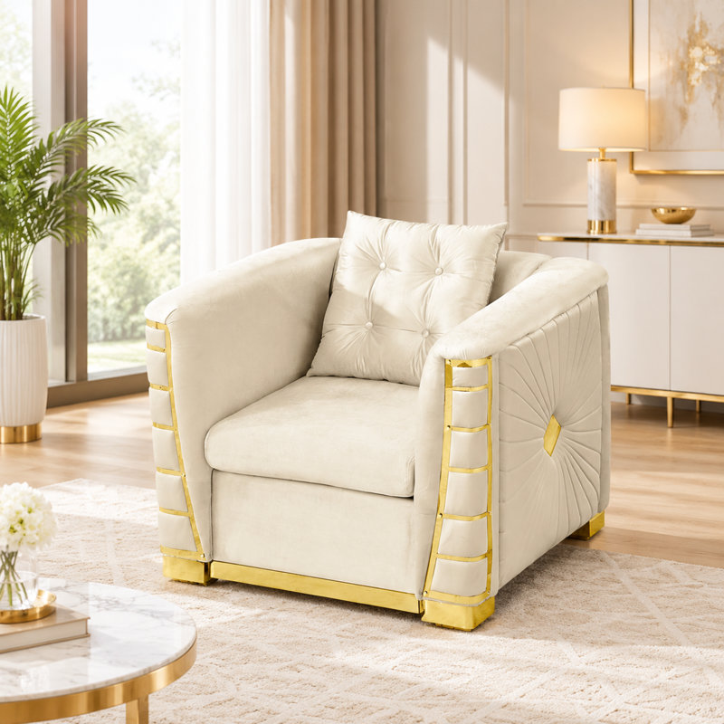Sofa une place en velours avec des détails métalliques dorés et un coussin décoratif