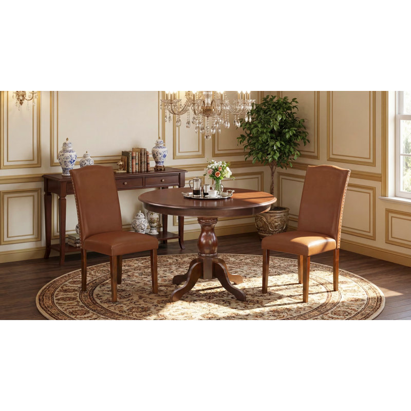 L'ensemble de table de salle à manger 3 pièces comprend une table de cuisine ronde avec piédestal et 2 chaises de salle à manger Parsons en similicuir brun, acajou