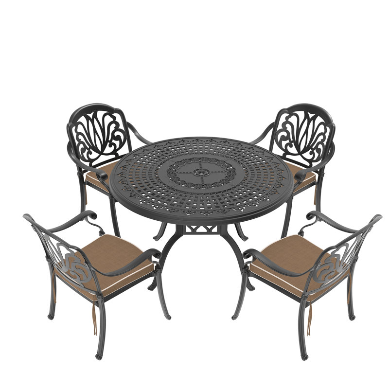 Patio en aluminium coulé noir avec coussins de salle à manger