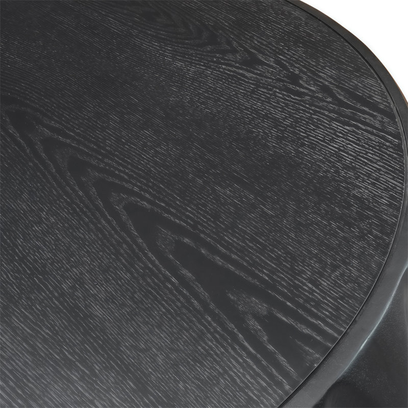 Table basse ronde en bois massif sculpté au design sculptural élégant