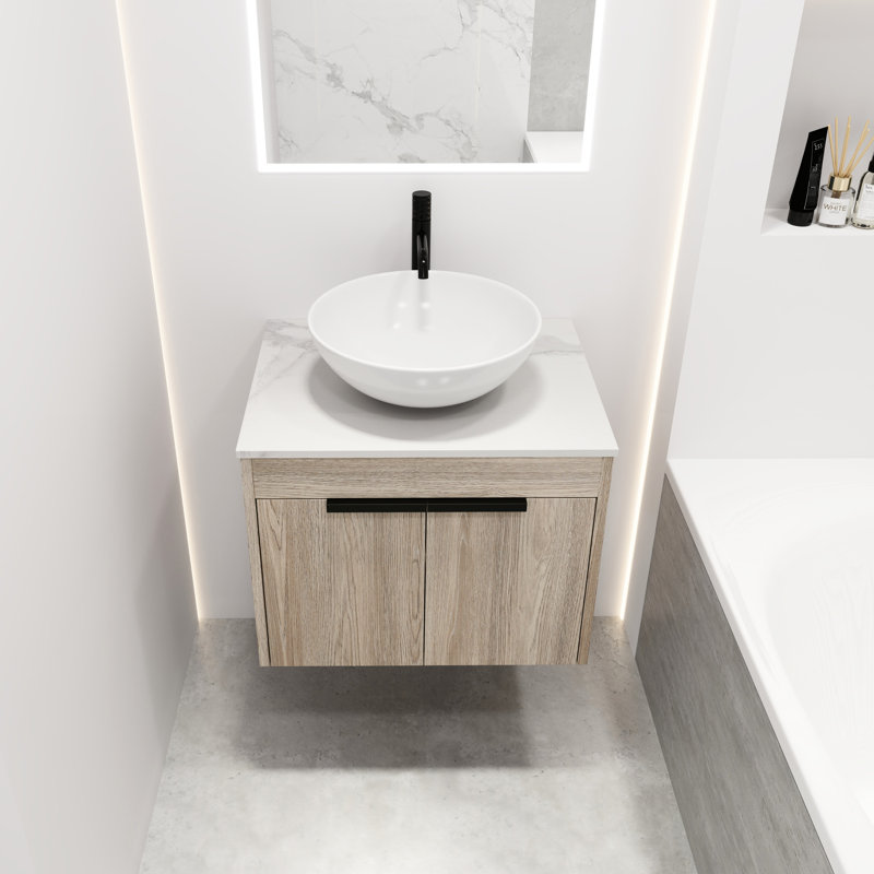 Meuble-lavabo contemporain en chêne blanc. Lavabo en céramique avec porte à fermeture en douceur et grand espace de rangement. Fixé au mur. Lavabo encastré 24 po. Fermeture douce pour une utilisation silencieuse.