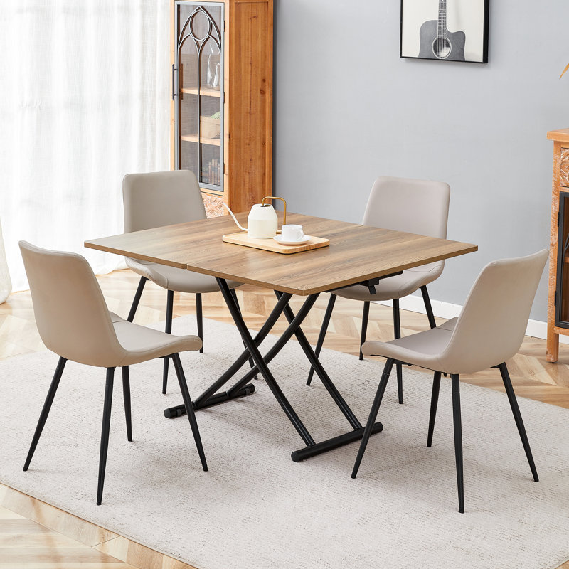 Ensemble de table de salle à manger à hauteur réglable avec plateau en bois aggloméré et pieds en métal noir, style multifonctionnel moderne avec 4 chaises en cuir pu pour la salle à manger, le café ou le bureau