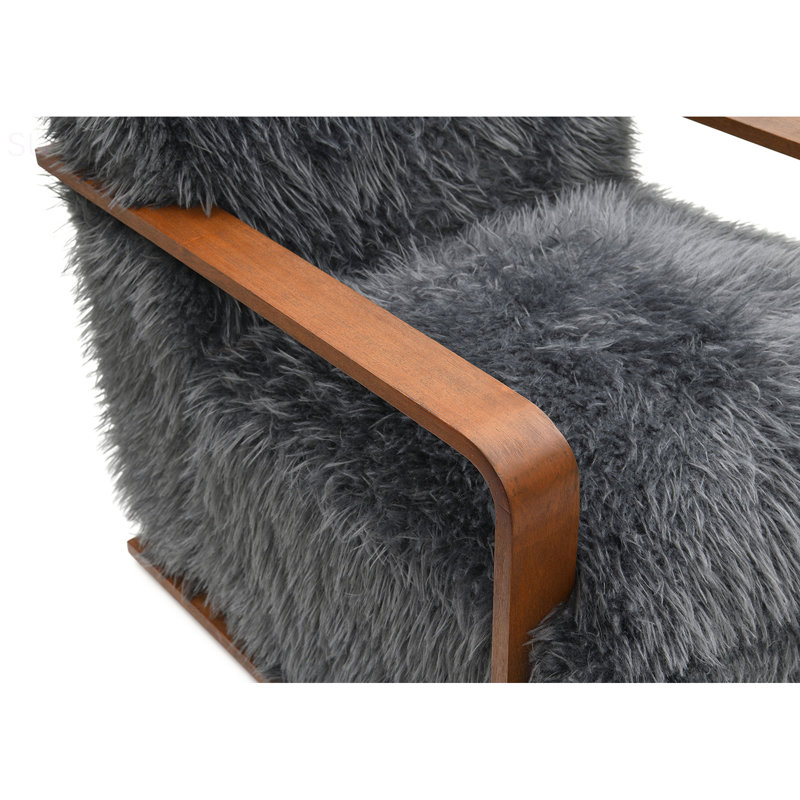 Fauteuil d'appoint 1 pièce à finition gris anthracite long en fausse fourrure douce d'inspiration rétro avec accoudoirs courbés en bois siège et dossier principaux