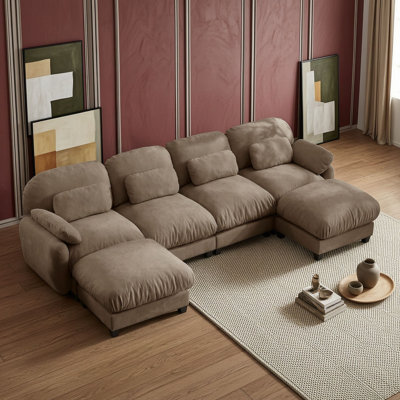 Canapé d'angle en U quatre places avec deux poufs
