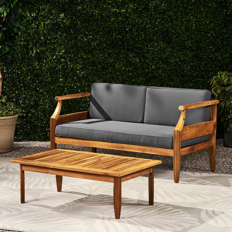 Ensemble de causeuse d'extérieur en bois d'acacia Aston_ Causeuse et table basse - finition teck + coussin gris foncé