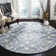 Ferrera Ikat Handmade Tufted Wool Blue / Ivory Area Rug