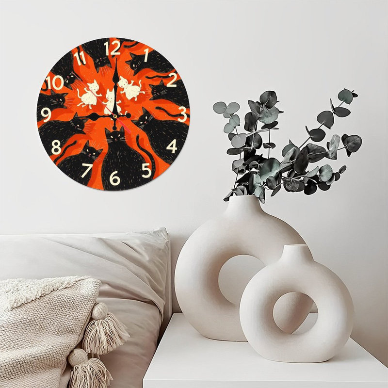 Horloge de chat sur fond orange