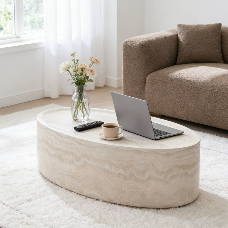 Table basse moderne ovale, finition pierre beige clair pour le salon
