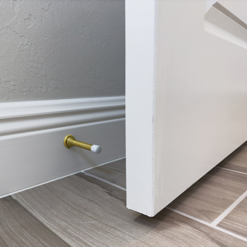 Door Stop, 4 In., Spring Steel, Antique Brass, Flexible, Baseboard, Brass