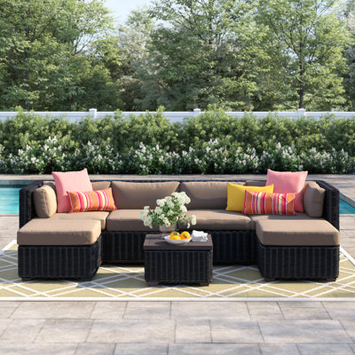 Ayomikun 7 Piece Rattan Sectional Seating Group with Cushions