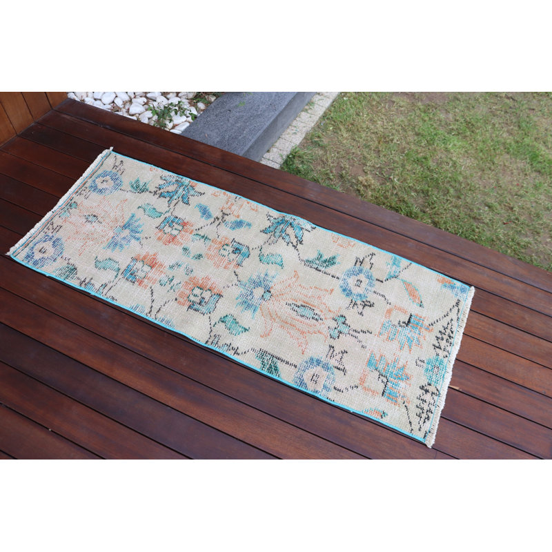 Vintage Turkish Door Mat Featuring A Handmade Wool Rug With Soft Pastel Tones And An Exquisite Floral Design