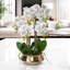 Faux orchidée dorée dans un pot de fleurs en céramique décor blanc élégant