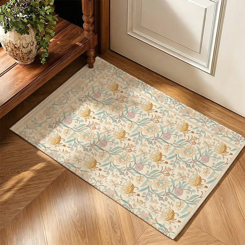 Tapis beige clair à petits motifs floraux, 119 x 79 cm, pour entrée.