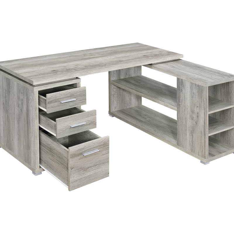 Bureau d'ordinateur en L gris effet bois flotté, 3 compartiments, au charme côtier, avec des espaces de rangement bien organisés et un aspect bois naturel. Cinq étagères.