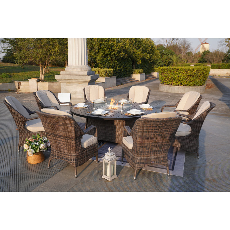 Pomos 8 - Person Wicker Patio Dining Set with Round Table , Cushions Included