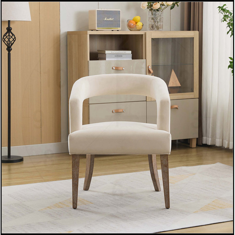 Chaise de salle à manger rembourrée en velours moderne avec pieds fuselés, confortable et élégante pour toute maison contemporaine.
