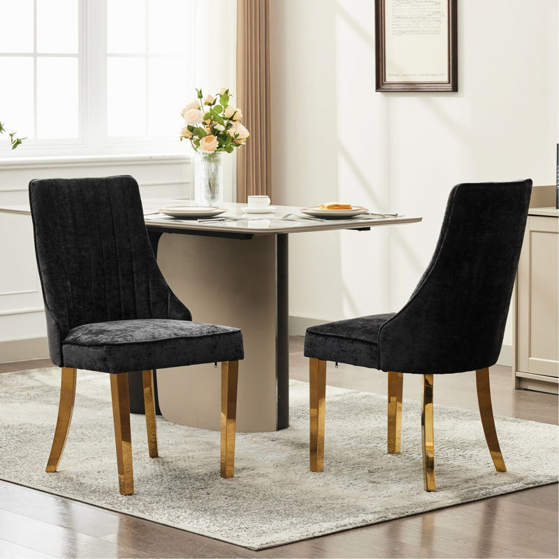 Chaises de salle à manger en rayonne recouvertes de tissu de rayonne avec dossier noir et 2 pattes plaquées en acier inoxydable doré pour un raffinement traditionnel et confortable