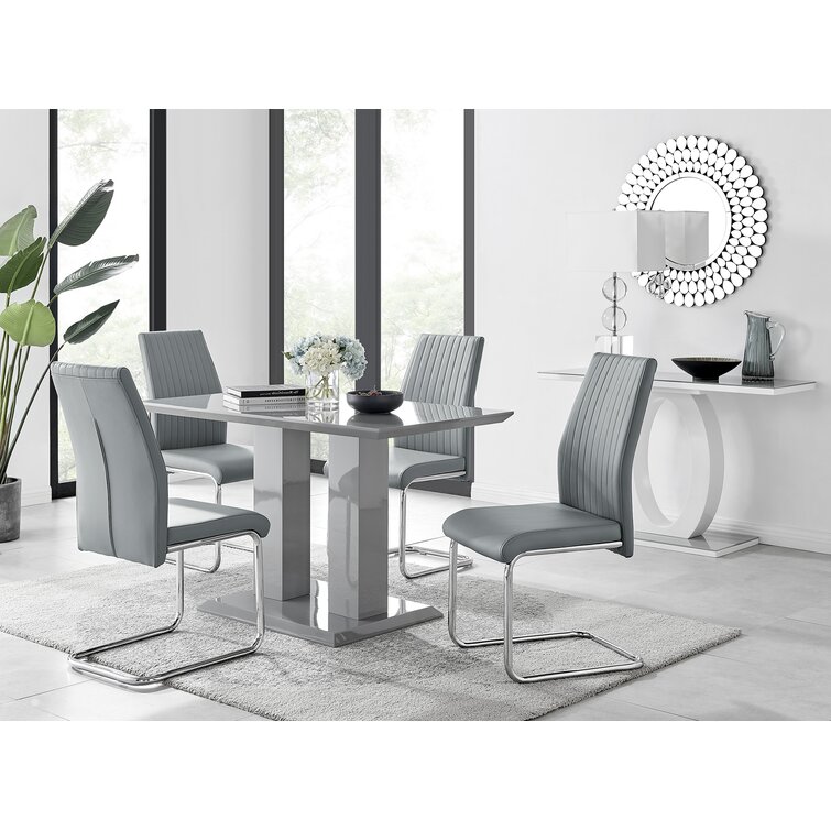 Edzard Double Pedestal High Gloss Dining Table Set with 4 Luxury Faux Leather Dining Chairs