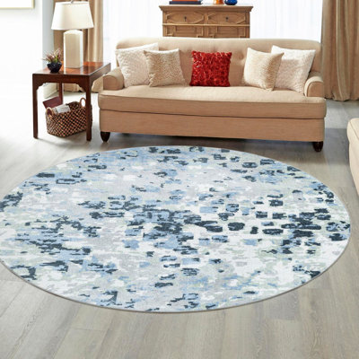 Tapis en polyester tissé à la machine Azion en gris / bleu marine / ivoire