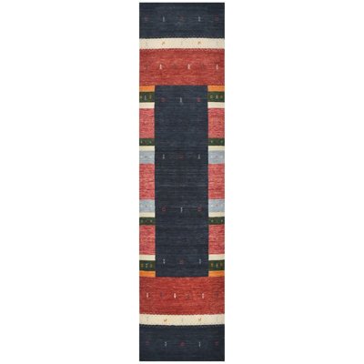 Hand Knotted Wool Area Rug in Black/Red/Green/Ivory
