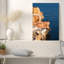 Tableau sur toile représentant un héron sur des falaises orange et blanches superposées-1924763306