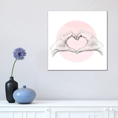 Heart In Hands by Laura Graves - Wrapped Canvas Print