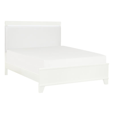 Grand lit blanc brillant avec tête de lit en similicuir et ornement lumineux