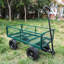 Chariot utilitaire vert à quatre roues avec roues solides pour faciliter le transport du bois de chauffage-121615336