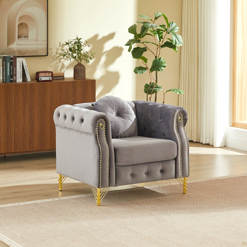 Canapé Chesterfield en velours avec coussins ronds